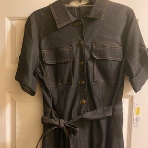 New size 16 dress, it runs small. It zips in the back.